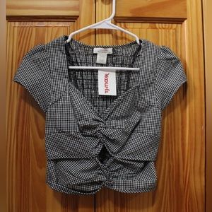 Urban Romantics black plaid crop top with front cut out.